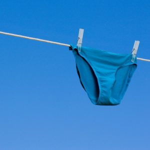 Blue underwear hanging on a clothes line